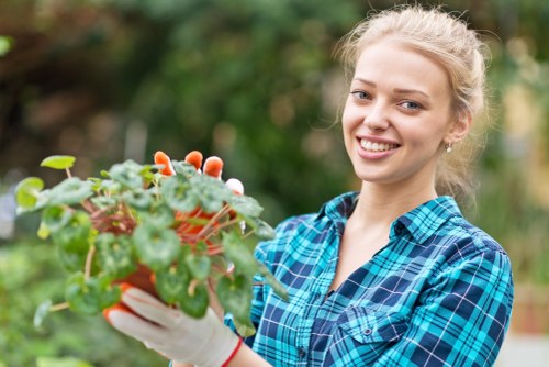 Team member assessing a Wimbledon garden for maintenance