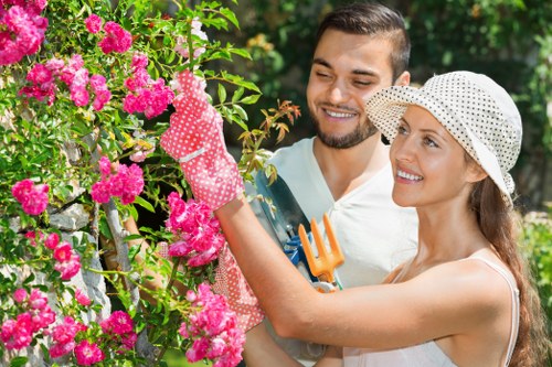 Gardener team arriving at a residential garden with equipment